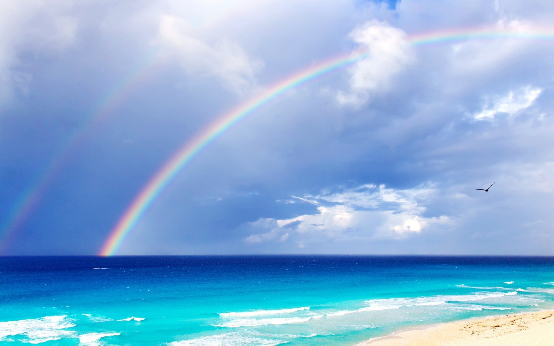 meer und ozean regenbogen wasser himmel landschaft strand sommer sonne natur ozean sand wetter meer reisen meer gutes wetter landschaftlich im freien landschaft himmel