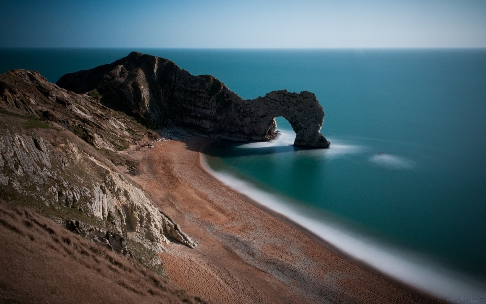 sea and ocean water beach seashore sea ocean travel landscape sunset sky seascape scenic rock island daylight surf