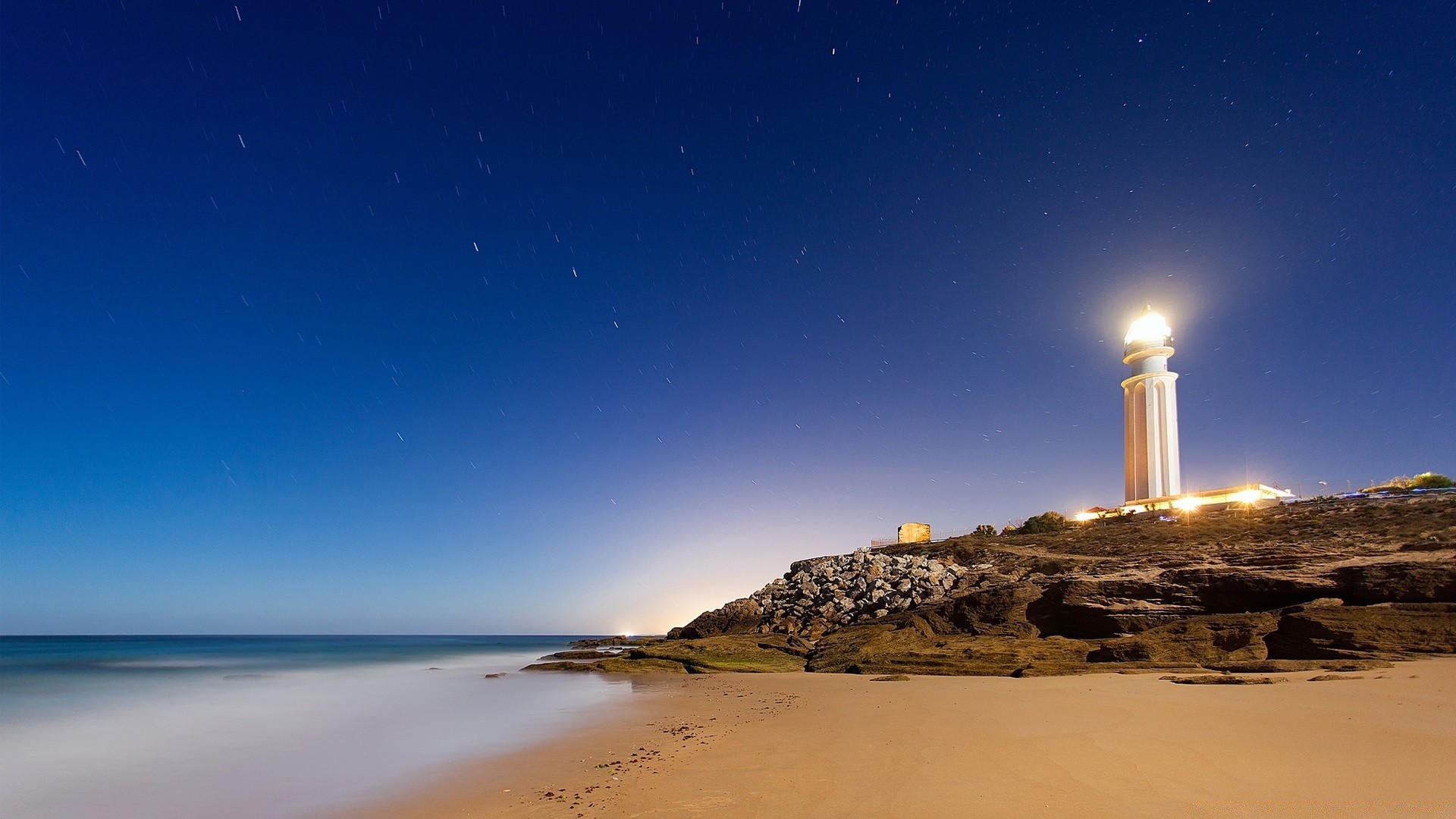 sea and ocean water moon sunset sky beach travel sea sun outdoors ocean nature dusk seashore dawn sand evening landscape lighthouse