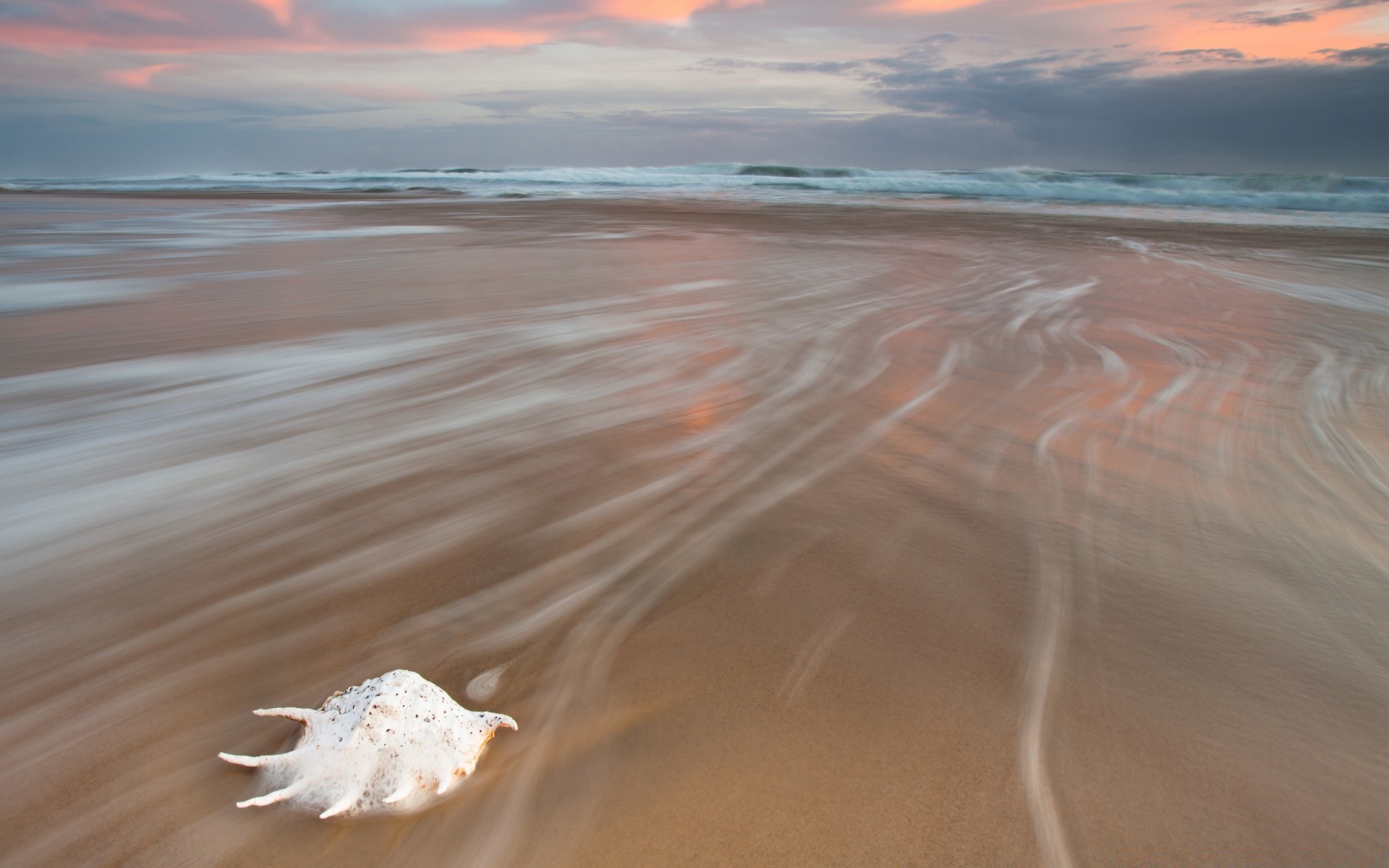 sea and ocean beach sand water sea seashore ocean travel wave summer vacation surf sun landscape nature sky shore tropical fair weather sunset