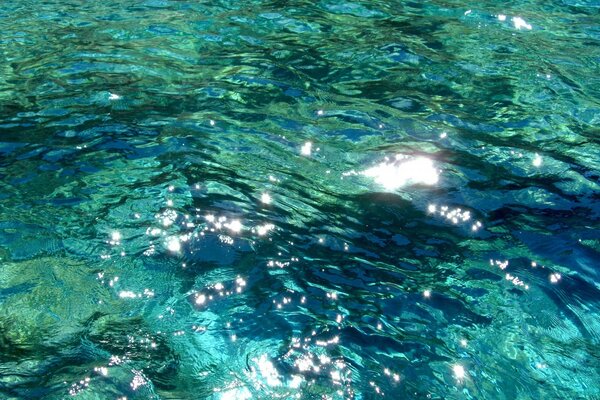 Turquoise water, stones under water