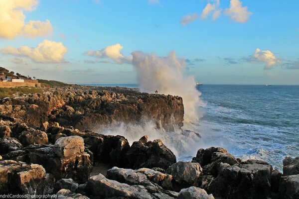 Sea and waves, rocks. Blue sky