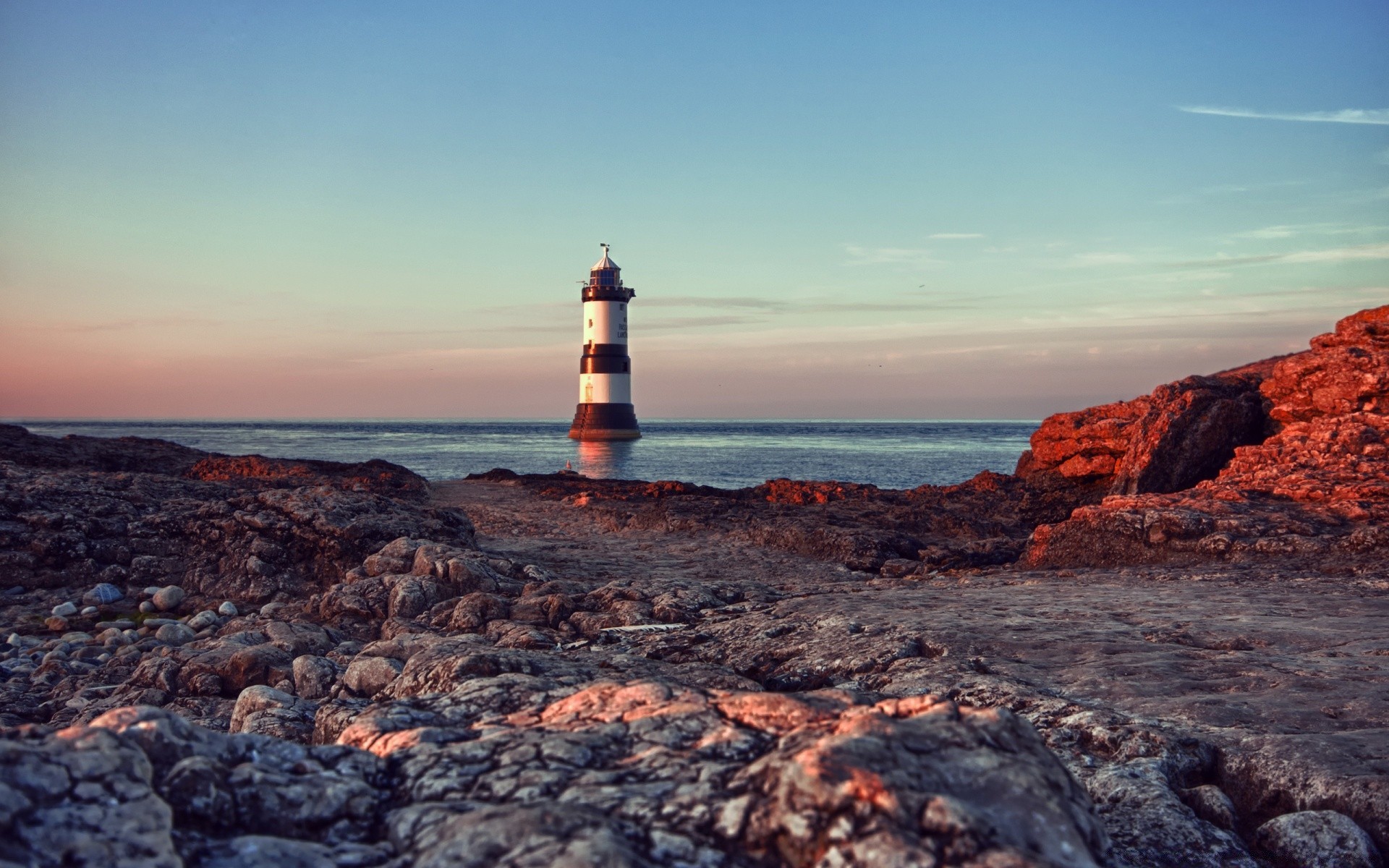 sea and ocean lighthouse sea seashore water ocean beach sky rock sunset nature seascape travel landscape shore outdoors island summer dusk evening