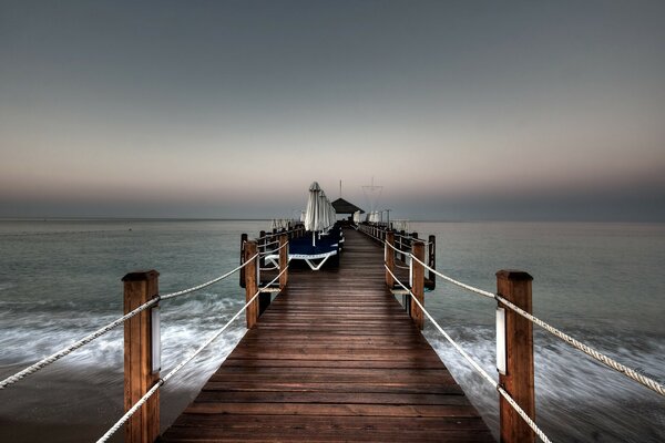 Pier over the ocean. Twilight