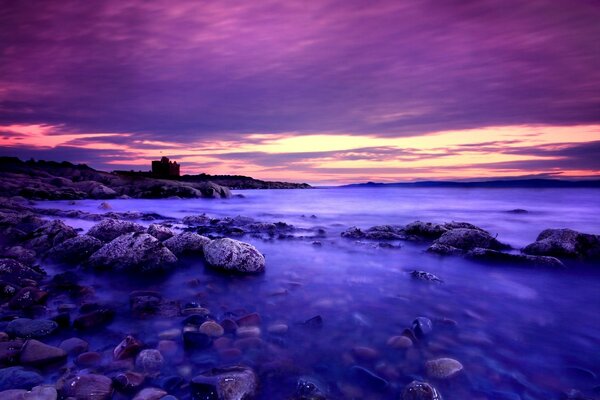 Purple clouds and blue water