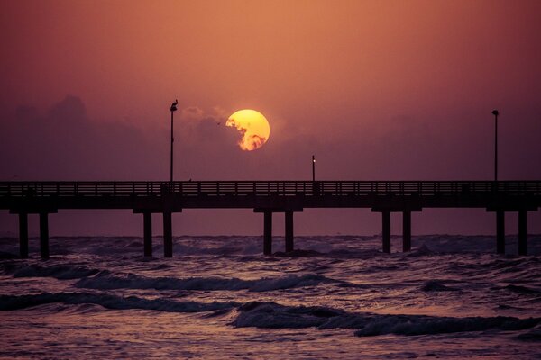 The bridge over the silver ocean stands