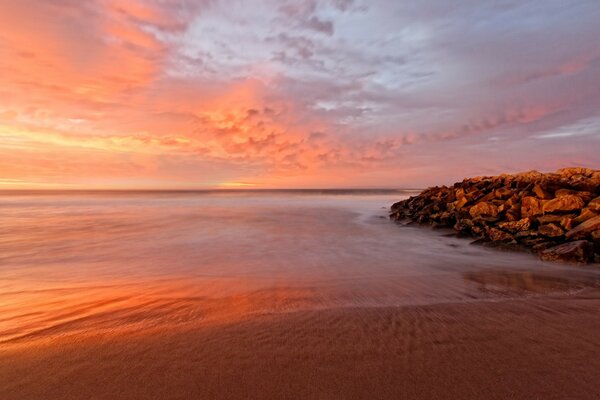 Orange-blue sky in the rays of sunset