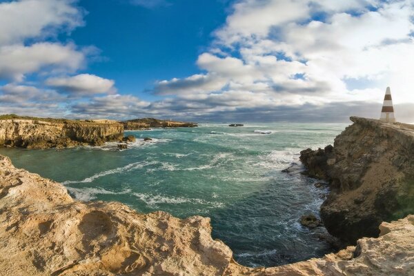 Sea and rocks, brightly illuminated by the sun