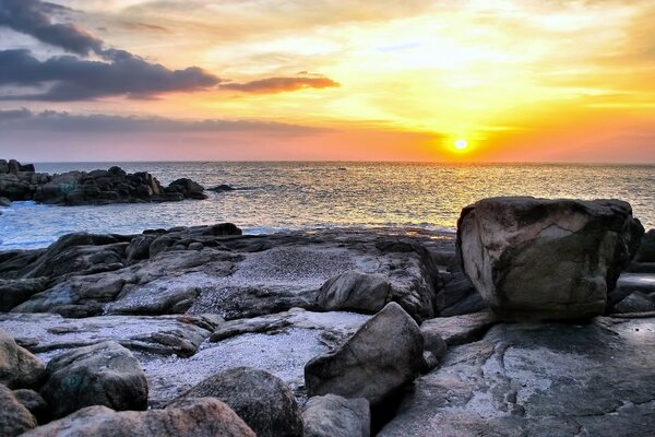 Rocky seashore at sunset