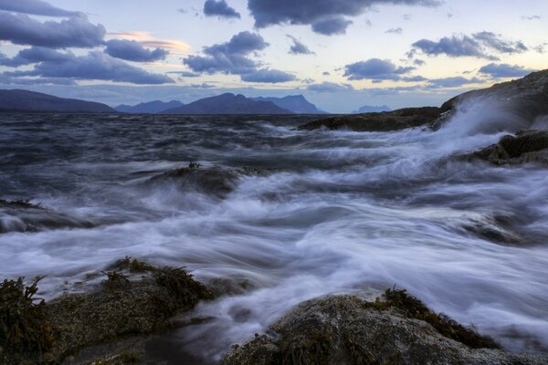 The riot of the elements against the background of the mountains