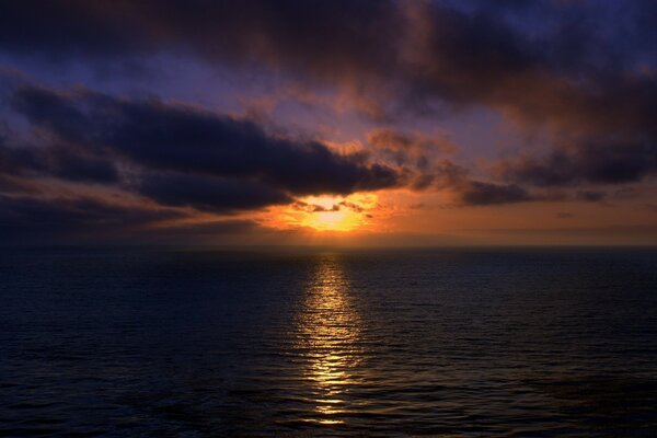 The glare of the sun on the water in the evening