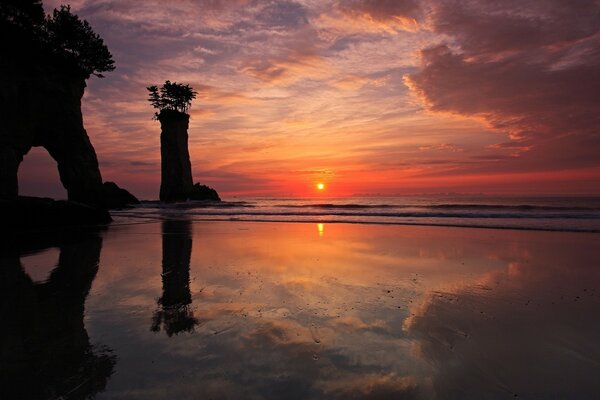 The sea sunset is beautifully reflected in the water