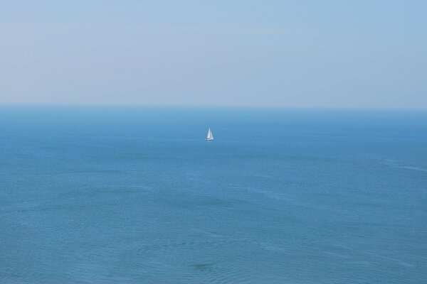 A ship on the high seas. Blue background