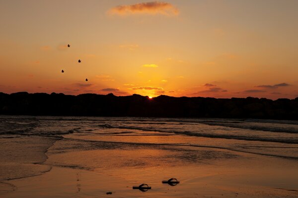 Hot orange sunset over the evening sea