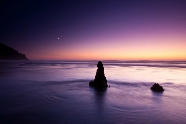 Sunset on the sea with dark water