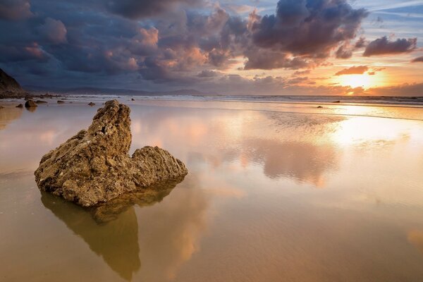 Sunrise on the beach near the sea