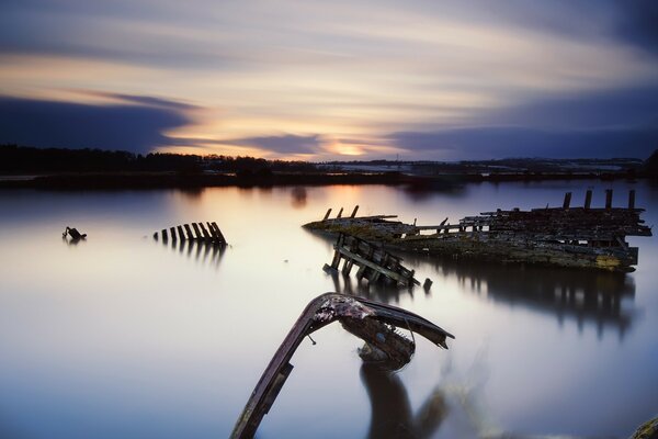 The remains of a ship on the blue sea