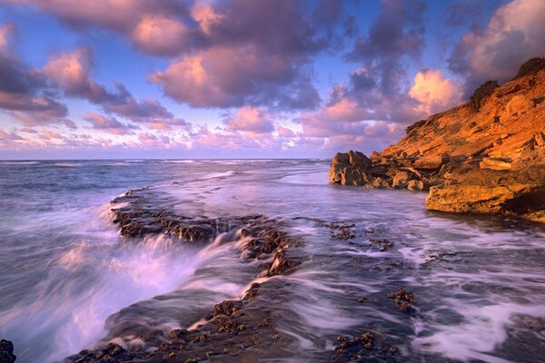 Ocean in the evening next to the rock