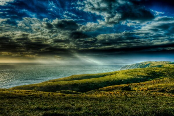 Meadow and shore before a thunderstorm