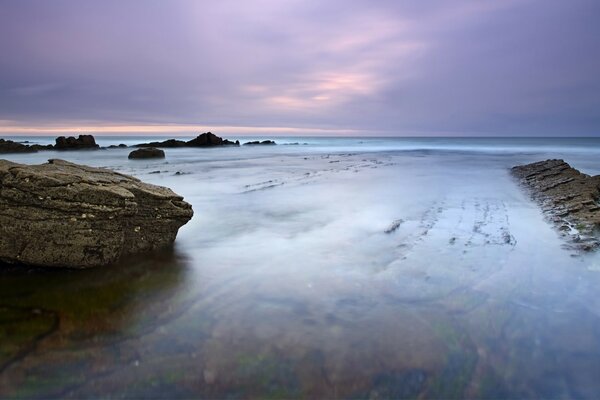 Sunset in the sea in lilac tones