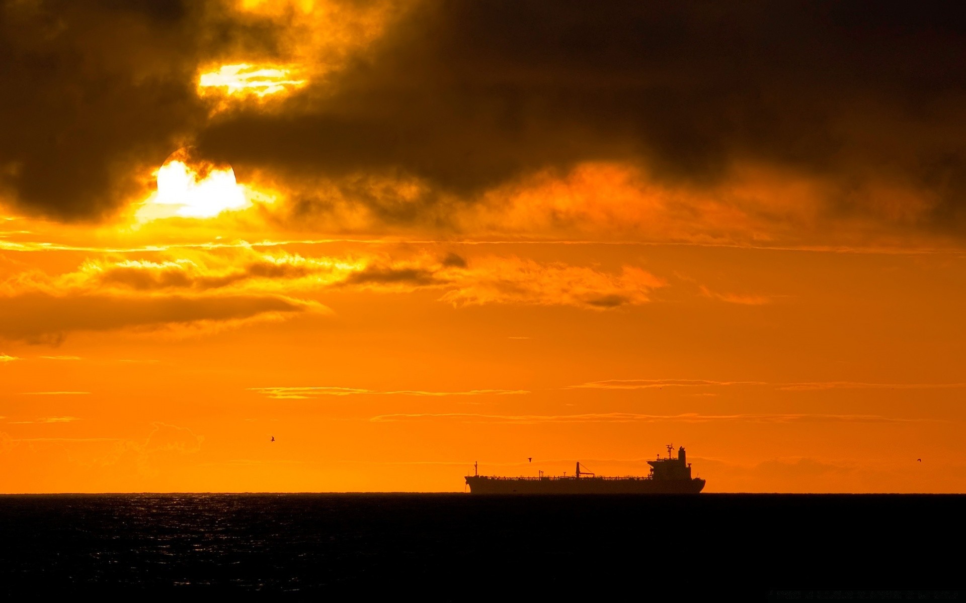 sea and ocean sunset dawn evening water dusk sky sea sun backlit beach silhouette light ocean landscape lighthouse