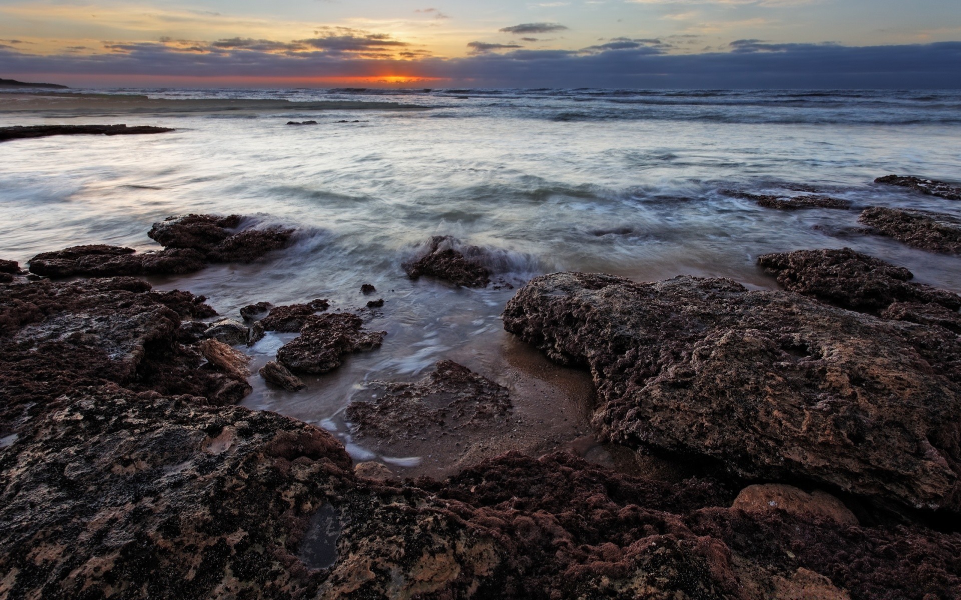 sea and ocean water seashore sea ocean beach sunset shore seascape landscape tide rock sand travel nature outdoors evening sky surf dusk