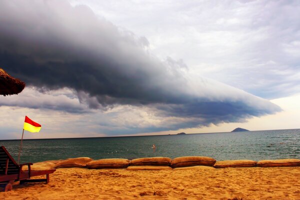 An impending thunderstorm on the ocean shore