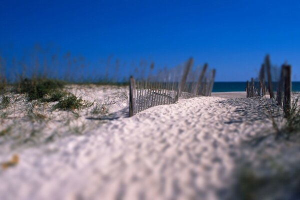 White sand sea blue sky