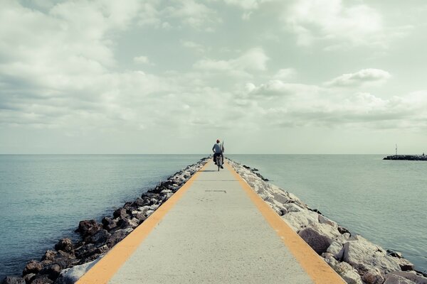 The road to the ocean and the cyclist