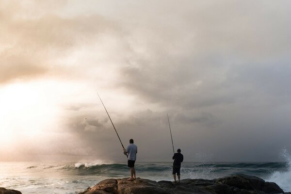 Fishermen catch fish on the seashore