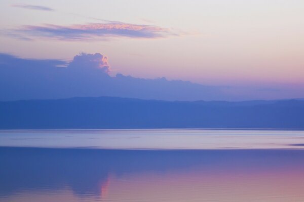 The surface of the sea at a lilac sunset