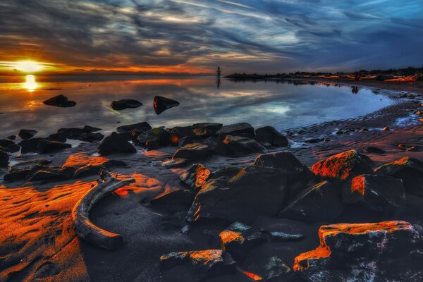 Sonnenuntergang Strand Steine Meer