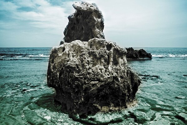 A lonely rock on the seashore