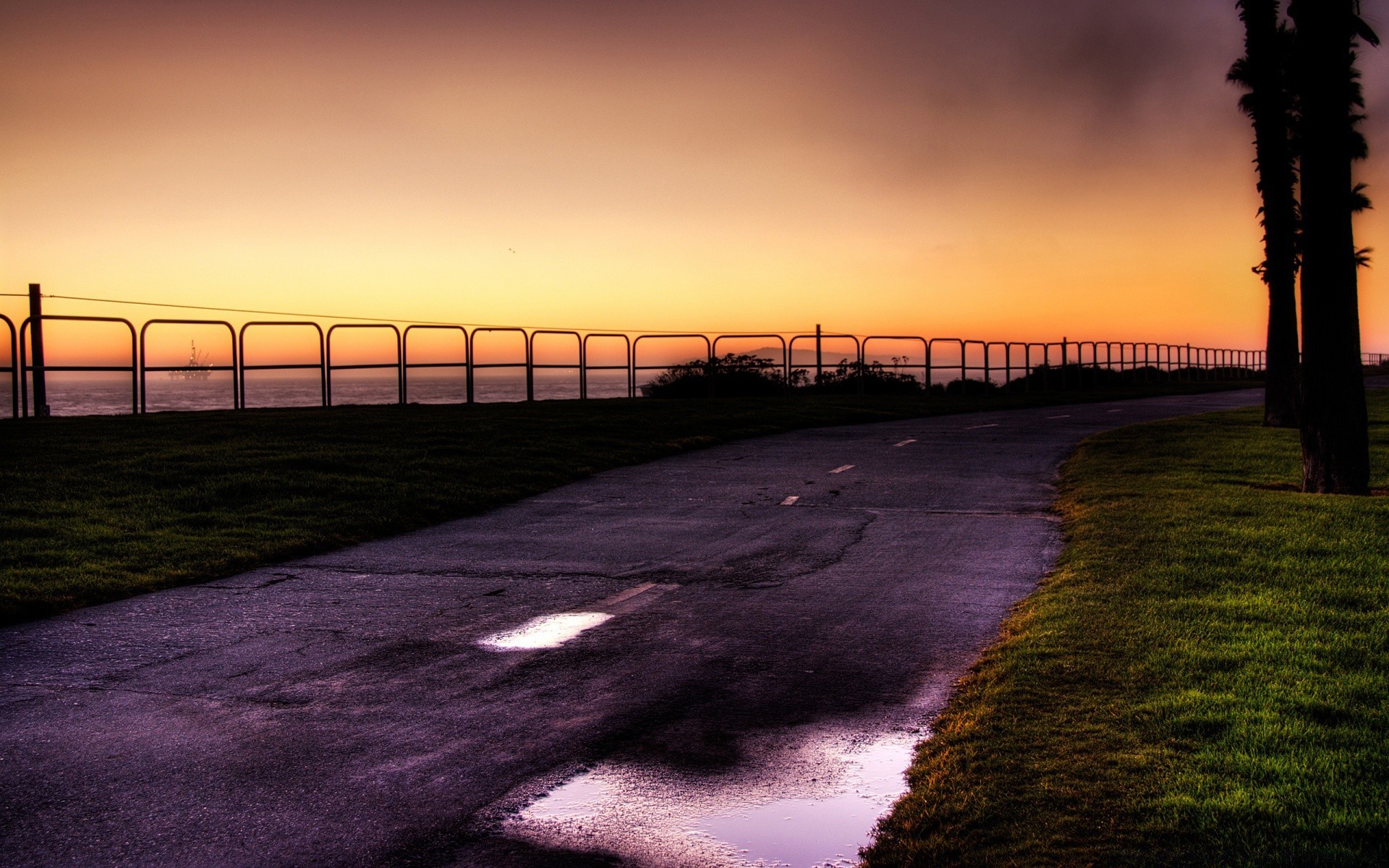 sea and ocean sunset dawn light landscape sky evening dusk water beach sun sea nature travel bridge road ocean dark