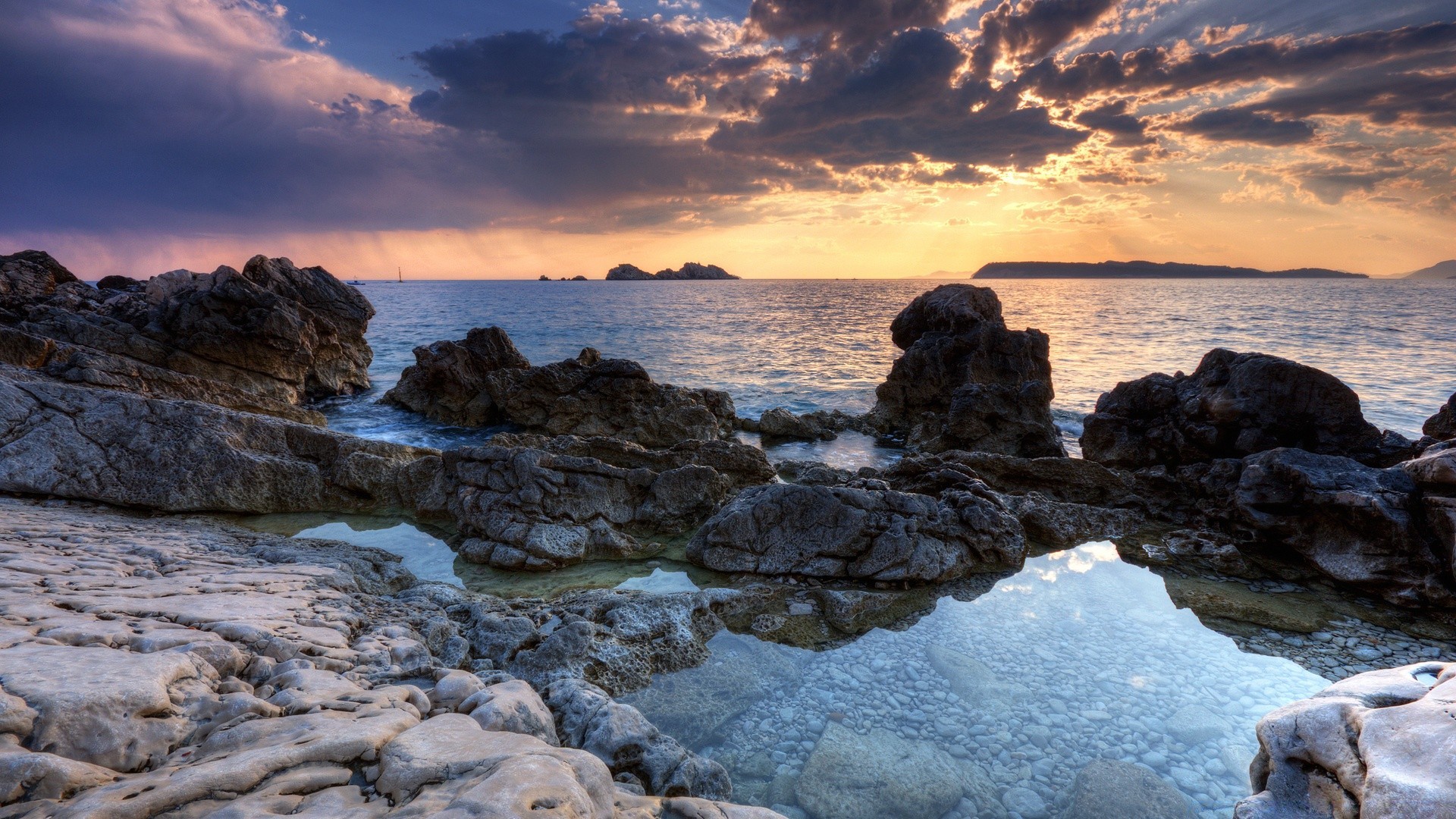 mar y océano agua mar océano puesta de sol playa mar roca paisaje paisaje cielo viajes naturaleza amanecer sol crepúsculo costa noche escénico buen tiempo