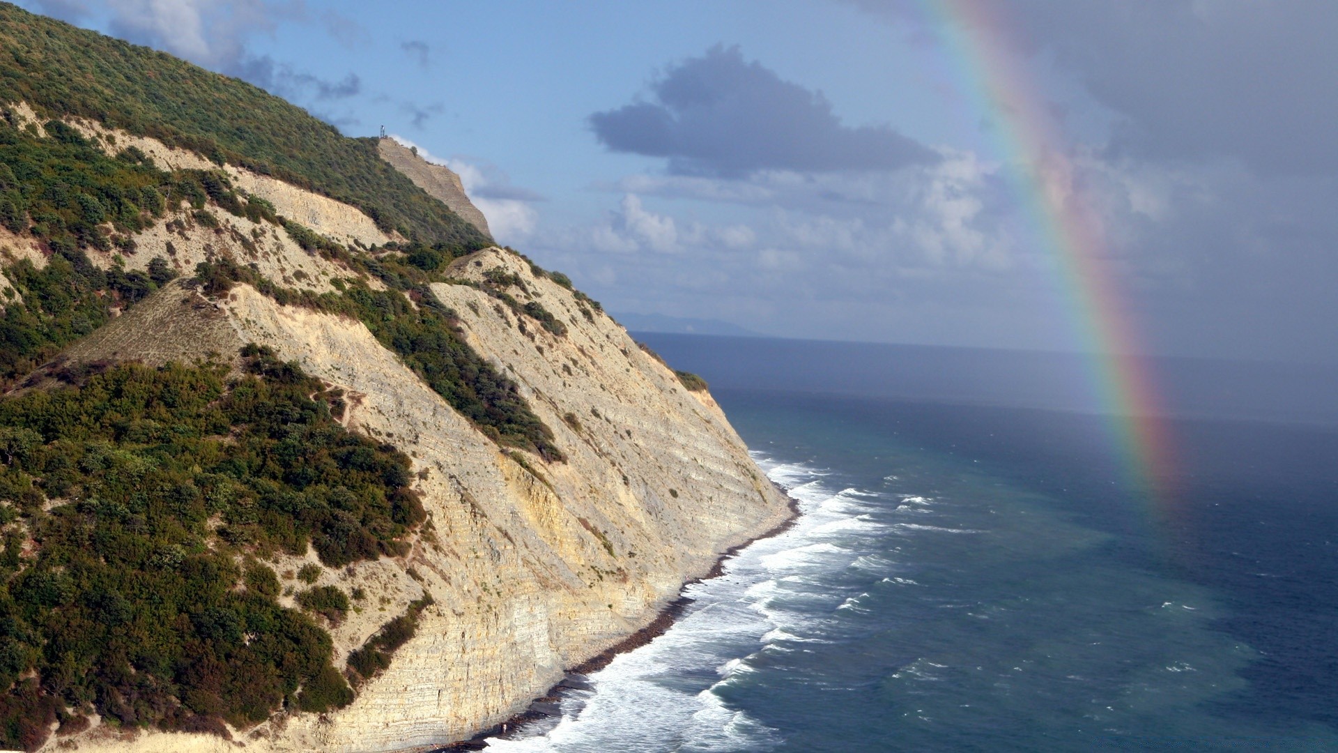 sea and ocean seashore water landscape ocean travel sea beach scenic sky rainbow nature seascape weather wave rock daylight island sand surf