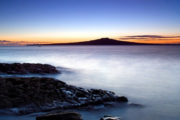 Twilight and fog over the ocean at sunset