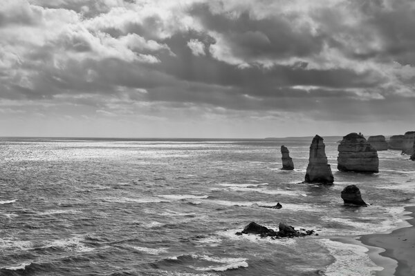 The grey sea is overshadowed by the weather