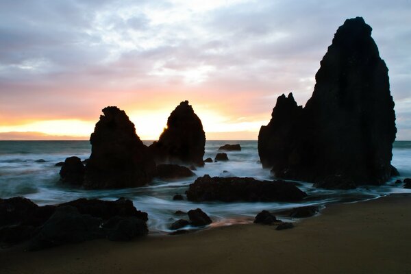 Meer bei Sonnenuntergang, Sandstrand