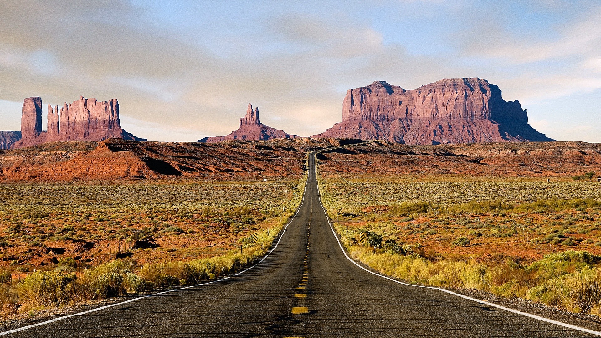 desierto viajes paisaje carretera cielo al aire libre piedra arenisca cañón naturaleza escénico montañas aride valle puesta de sol remoto roca carretera estéril seco