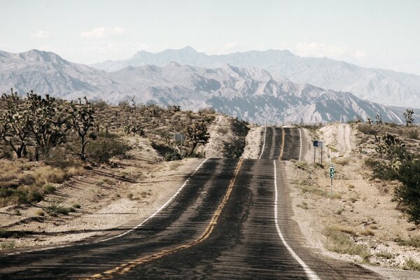 The dusty road leads to the mountains