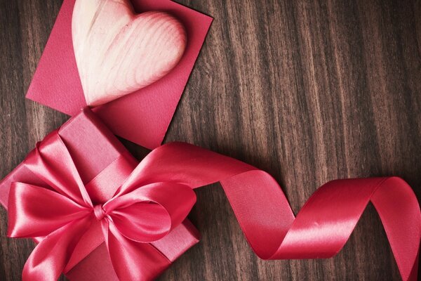 A gift heart in an open box on the table