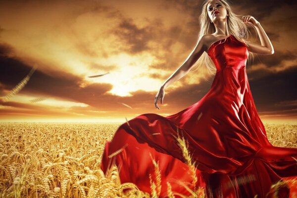 A girl in a red dress on a wheat field