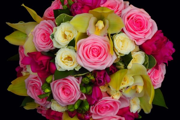 A beautiful bouquet of yellow and pink roses in a package