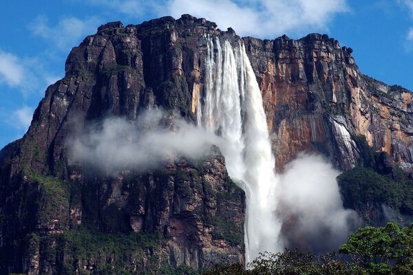 Majestic waterfall falls from the mountains