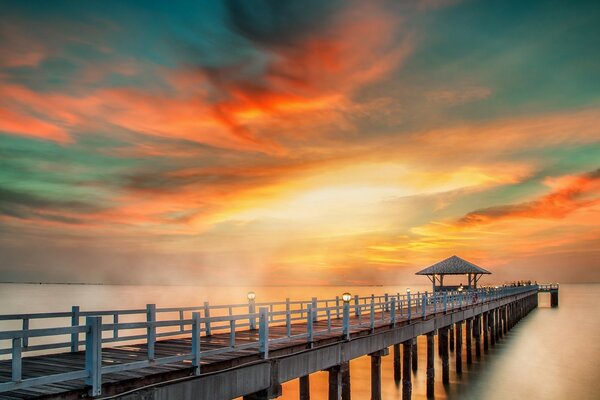 A long pier stretching into the sea