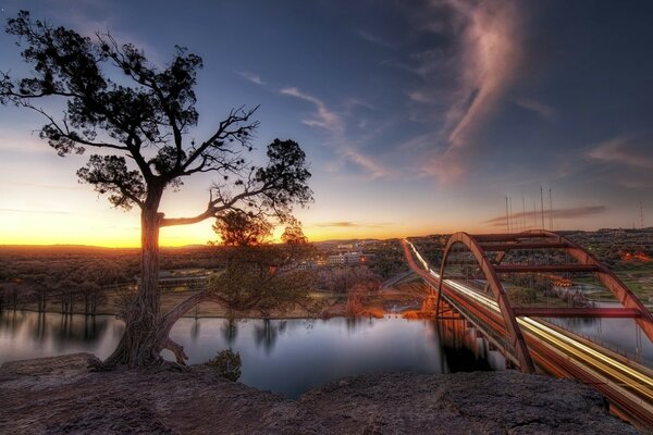 A large bridge over a quiet river