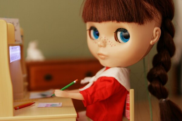 The doll does her homework indoors