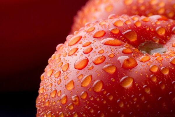 Macro photography of red fruit in drops