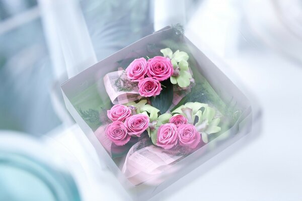 Pink roses in a box for a wedding